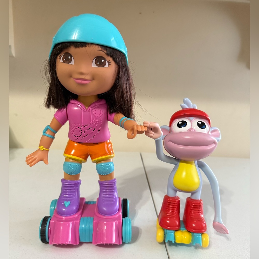 Fisher-Price Skate & Spin Dora & Boots toy set.
English and Spanish. Tested!